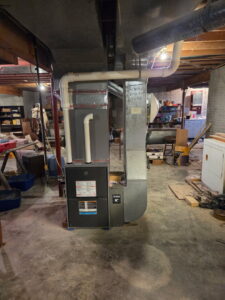 A new furnace and ductwork installation in a basement by Black Tie Home Services in Springfield, IL