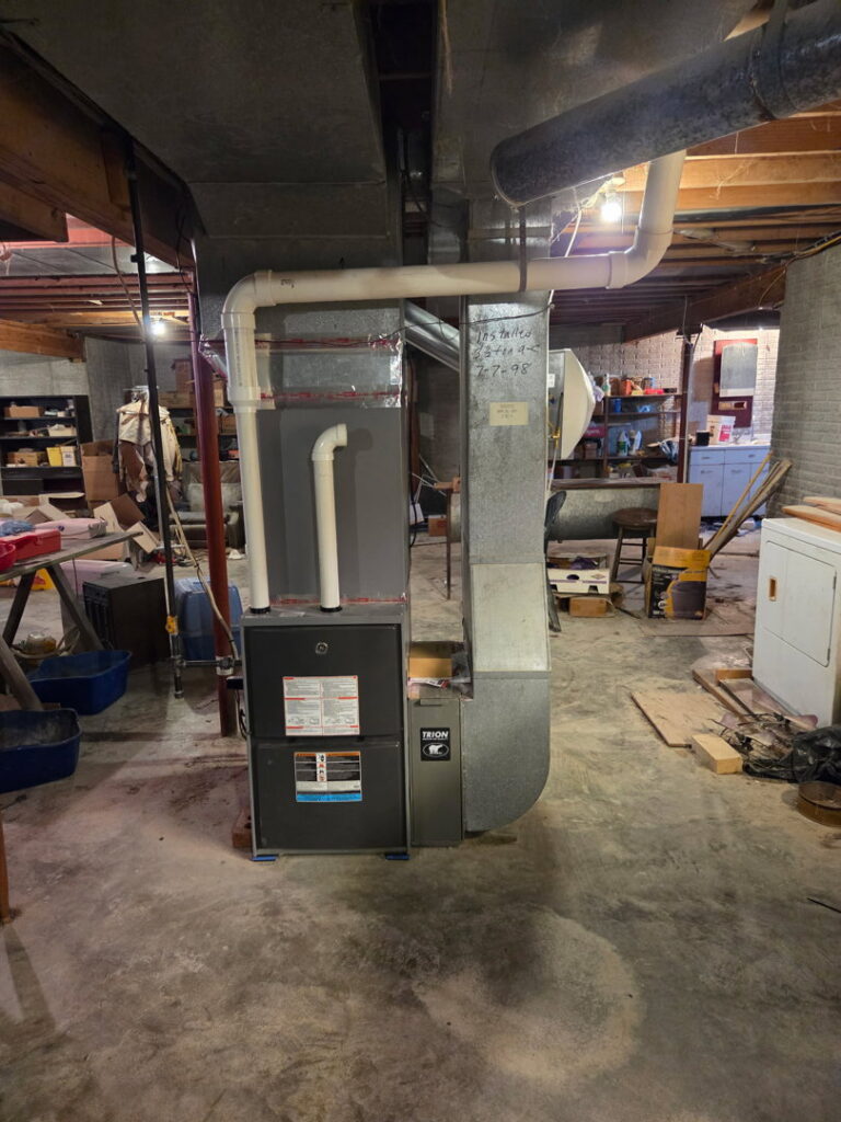 A new furnace and ductwork installation in a basement by Black Tie Home Services in Springfield, IL