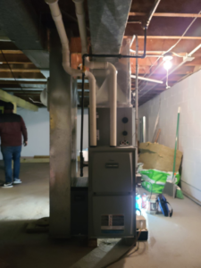 A new furnace and ductwork installation in a residential basement by Guzman Heating & Cooling in Milwaukee, WI.