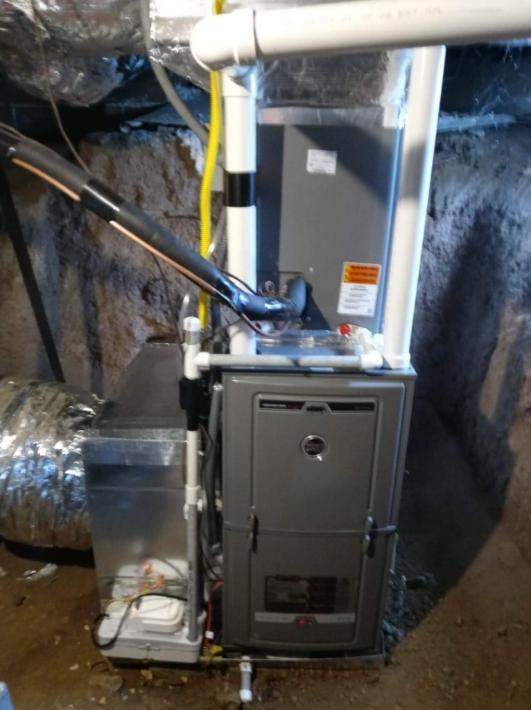 A newly installed furnace and ductwork system in a residential crawl space by Morse Brothers Heating and Air in Franklin, TN.