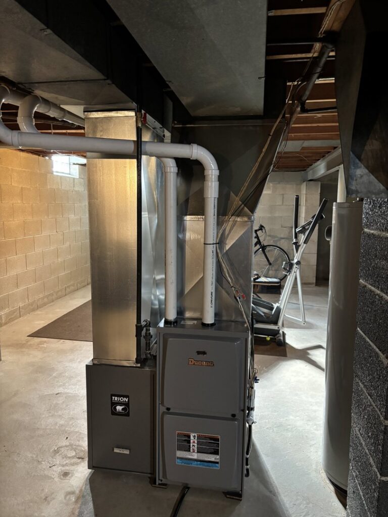 A new Ducane furnace and Trion air cleaner installation in a basement by Nordic Air Heating & Cooling in West Allis, WI.