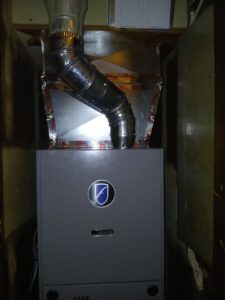 A newly installed furnace unit with connected ductwork, ready for operation by A-1 HVAC in Kansas City, KS.