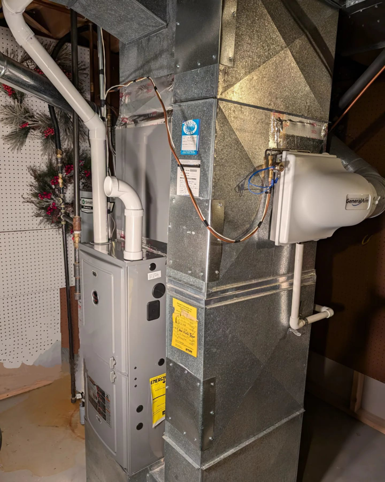 A newly installed furnace and ductwork with a humidifier by Frank N Frank Mechanical Contractors in Rochester, NY.