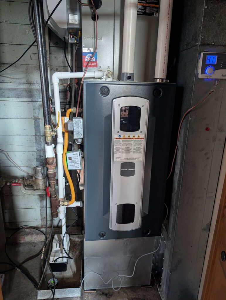 A newly installed furnace and air handler unit by Family Heating & Air Conditioning in Indianapolis, IN.