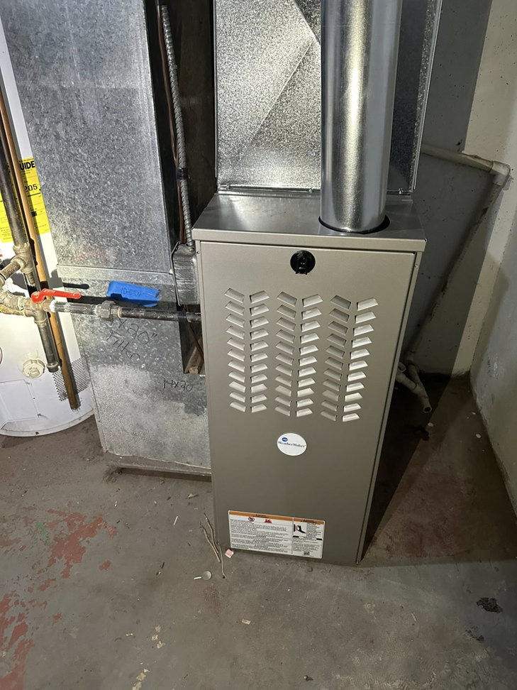 A newly installed furnace and ductwork by F&S Heating And Cooling in Elgin, IL.