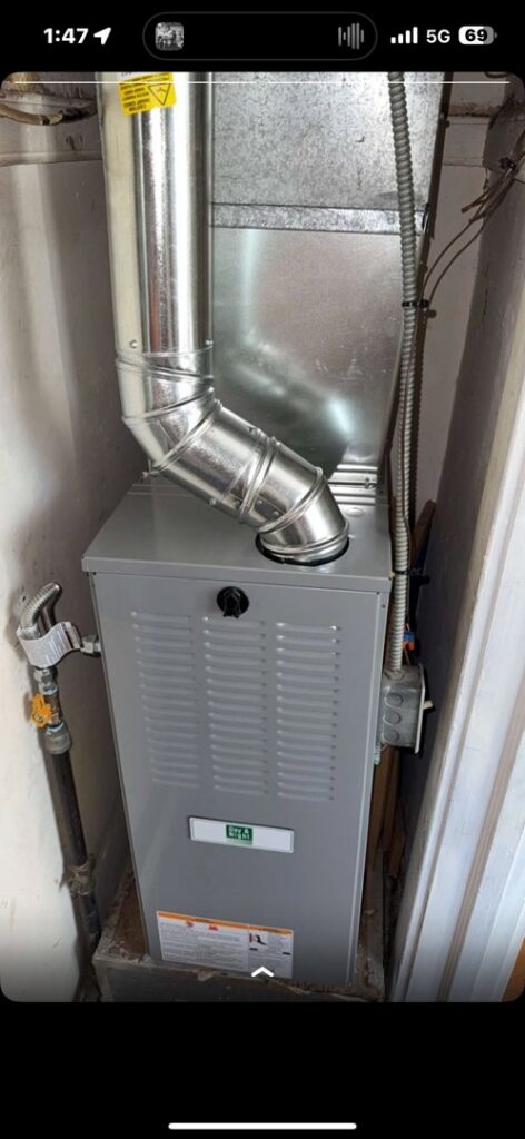 A newly installed furnace unit with shiny new ductwork and gas line connections by Lopez Mechanical HVAC in Kansas City, MO.