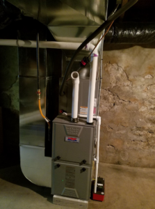 A newly installed furnace and ductwork in a basement by Manz Heating and Cooling in Fort Wayne, IN.