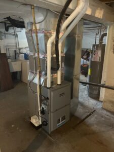 A newly installed furnace and air handler unit in a basement by R. Davis Mechanical in Pittsburgh, PA