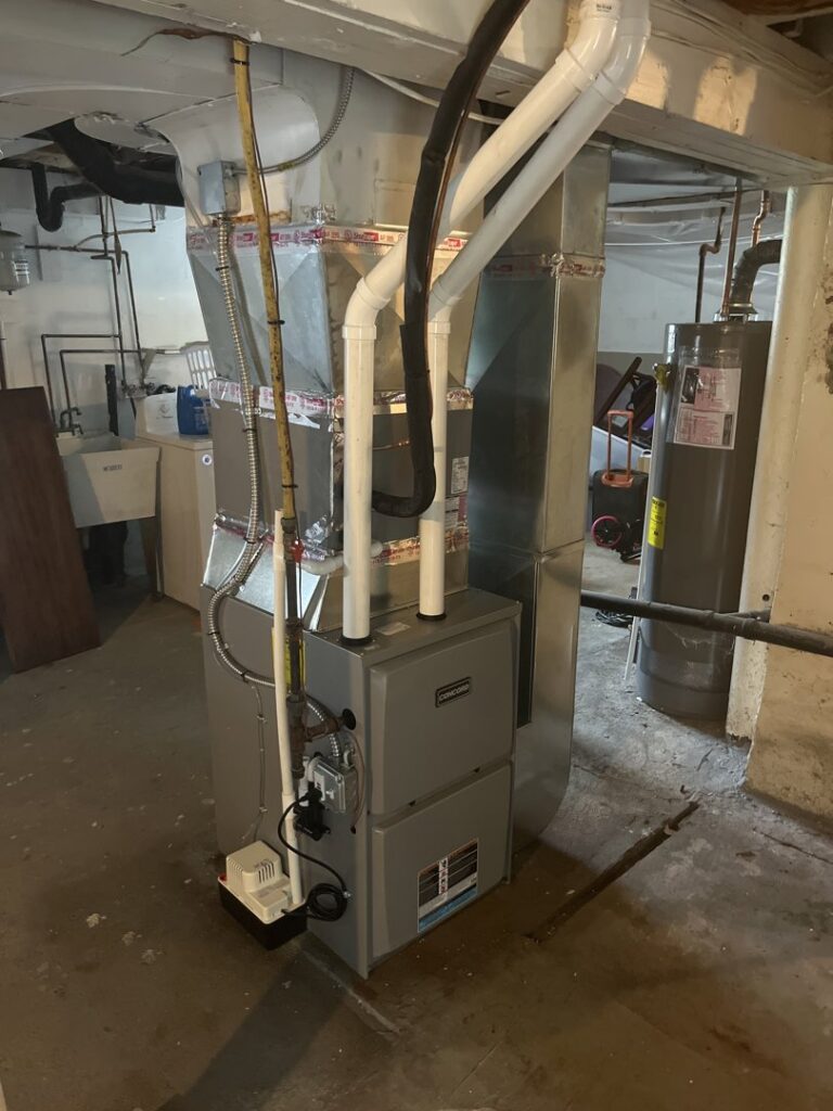 A newly installed furnace and air handler unit in a basement by R. Davis Mechanical in Pittsburgh, PA