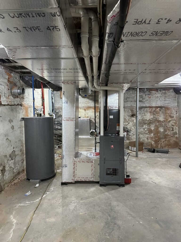 A new furnace, water heater, and ductwork installed in a basement by P3 Mechanical Heating & Cooling in Bainbridge, PA.