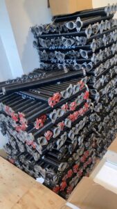 A stack of new garage door torsion springs, ready for installation or replacement by BSD Garage Door Service in Naperville, IL.