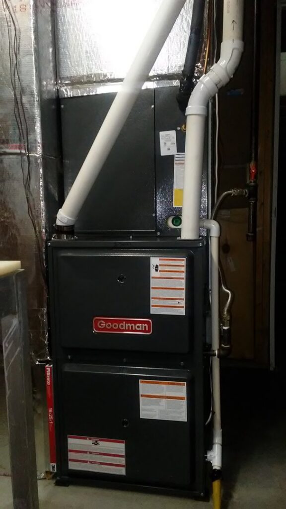 A new Goodman furnace installation with ductwork and PVC piping by I & M Heating and Cooling in South Bend, IN.