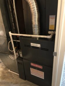 A new Goodman furnace and associated ductwork installed in a utility closet by EPIC Heating and Air in Loveland, CO