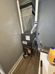 A new Goodman furnace and ductwork installed in a residential utility closet by Family First Heating and Cooling Repair LLC in Toledo, OH.