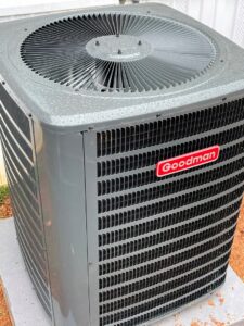 A newly installed Goodman outdoor HVAC condenser unit, showcasing quality installation by Mission HVAC in Huntsville, AL.