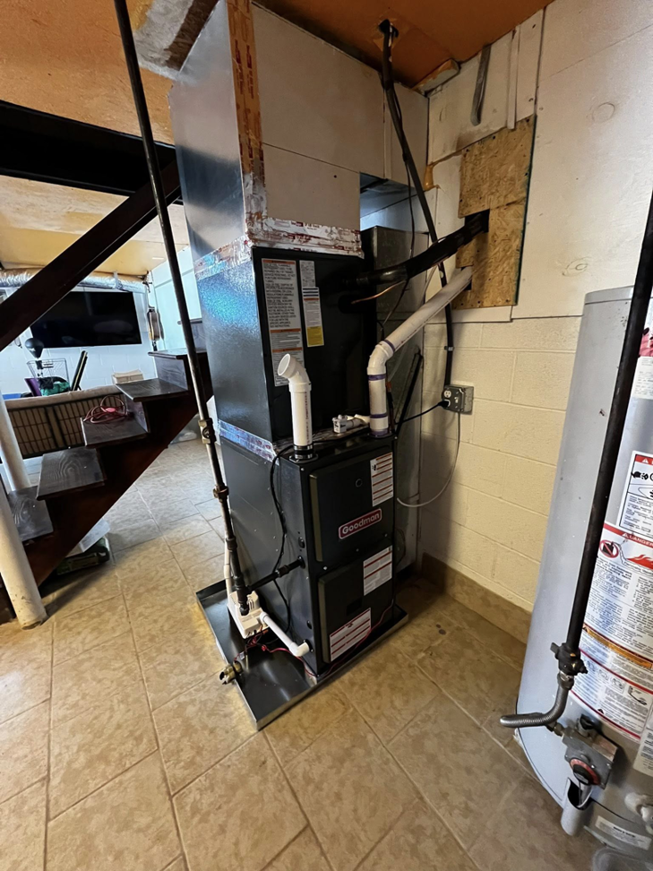 A newly installed Goodman brand HVAC furnace and air handler unit by Arctic Desert Cooling & Heating in Concord, NC