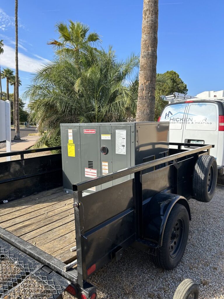 A new Goodman HVAC unit loaded on a trailer, ready for installation by Hicken Air in Gilbert, AZ