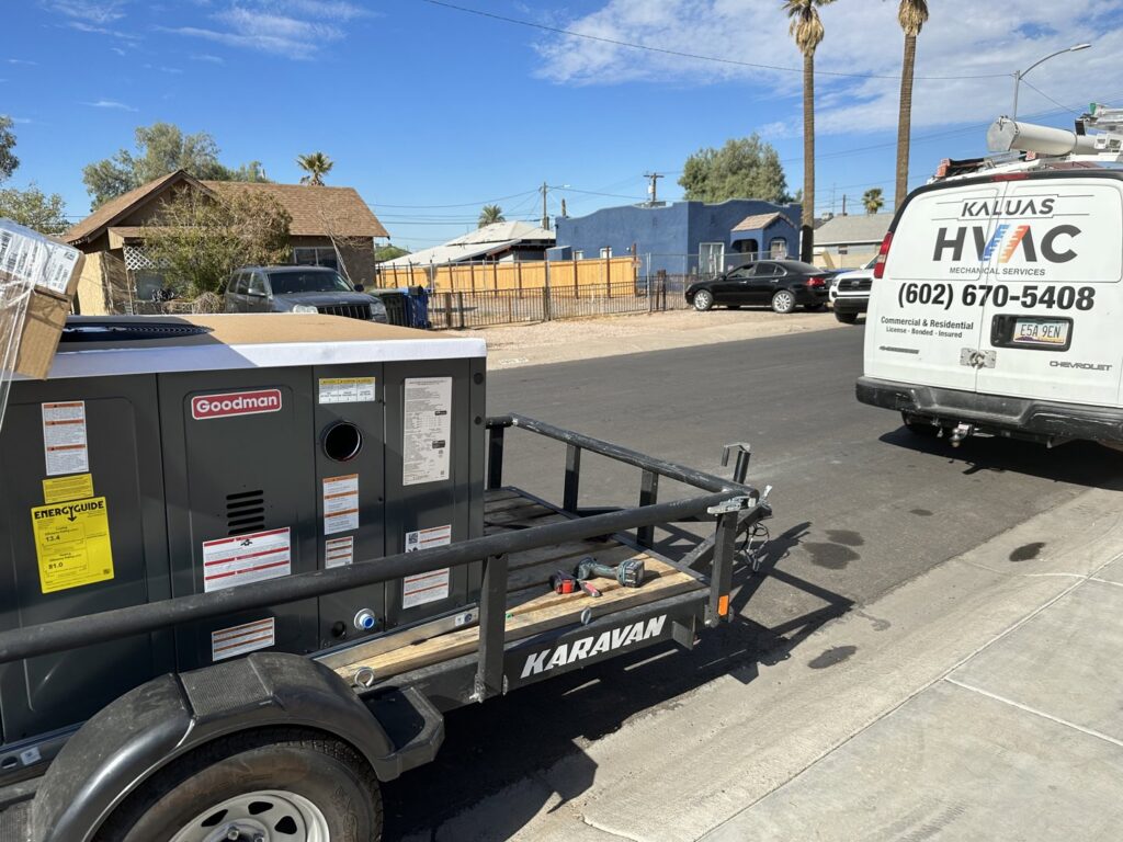 A new Goodman HVAC unit on a trailer, ready for installation by Kaluas HVAC Mechanical Services in Phoenix, AZ