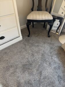 A newly installed gray carpet in a bedroom, showcasing quality work by NPN Flooring in Brookfield, IL.