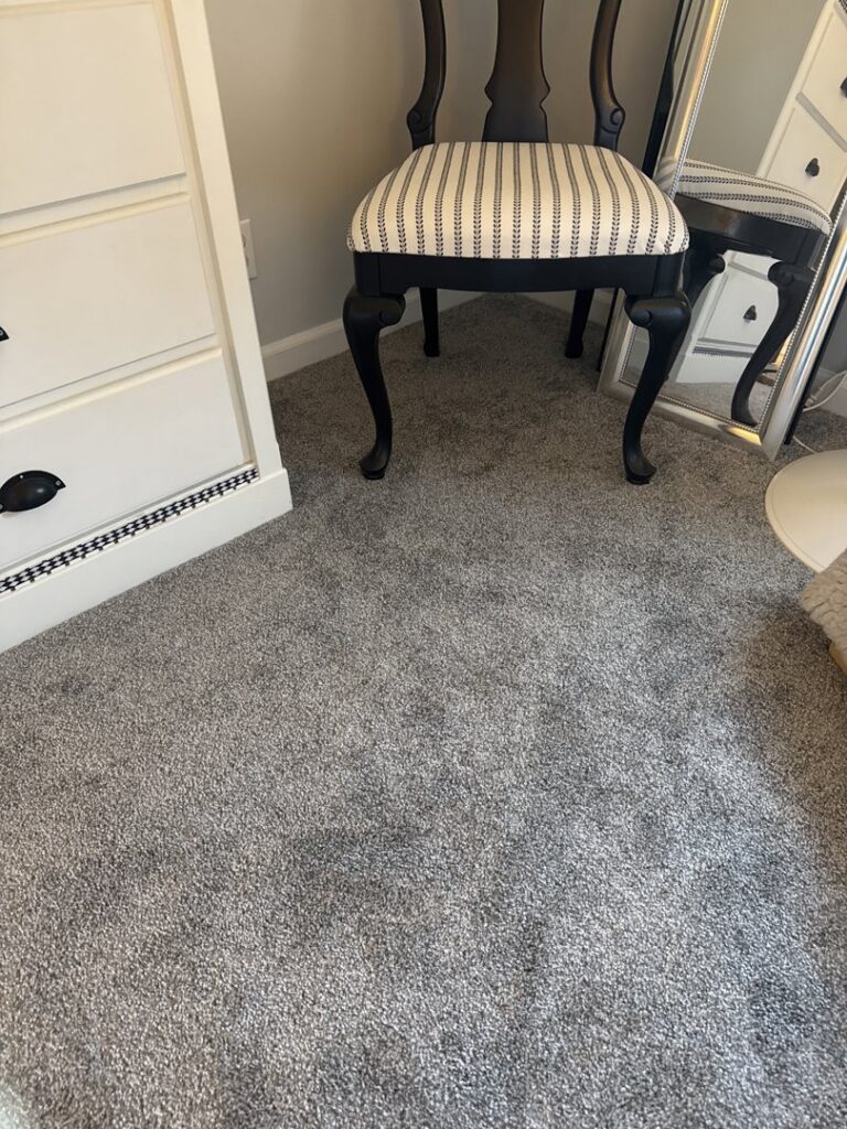 A newly installed gray carpet in a bedroom, showcasing quality work by NPN Flooring in Brookfield, IL.