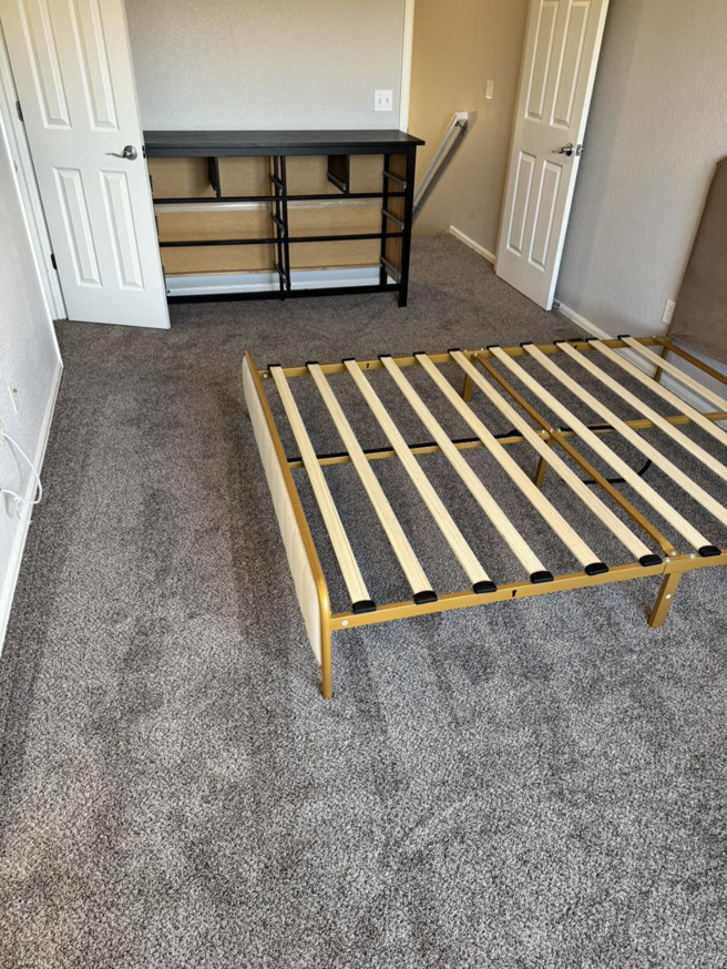 Newly installed grey carpet in a bedroom, showcasing quality work by Cruz Carpet / Vidal Cruz in Colorado Springs, CO