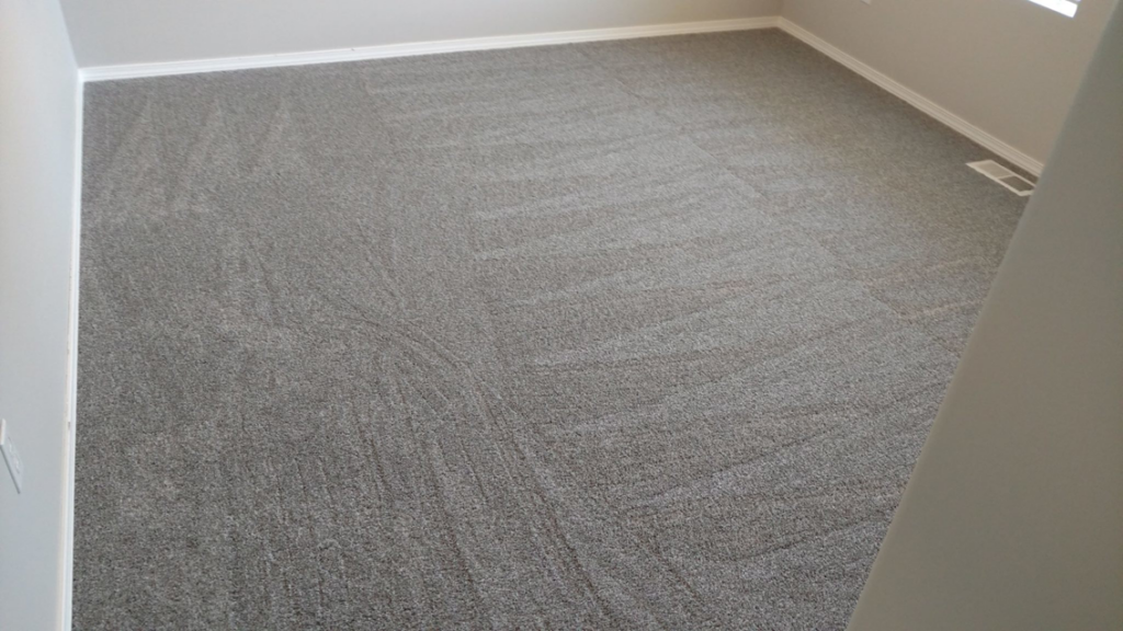 Newly installed grey carpet in a room by George Babb Floor Covering in Enumclaw, WA.