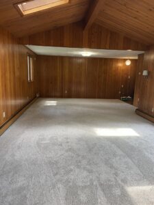 Freshly installed grey carpet in a spacious residential room by CAP Flooring in Buffalo, NY