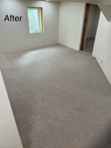 A newly installed grey carpet in a room, showcasing a completed carpet contractor job by Scott's Flooring in Miles City, MT.
