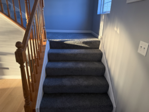 A modern stairway featuring new grey carpet installation by Carpet Near Me, proudly serving Services Available In.