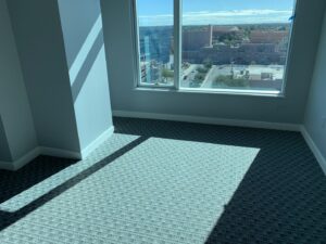 A room featuring new grey patterned carpet, expertly installed by Canyon State Flooring in Queen Creek, AZ.