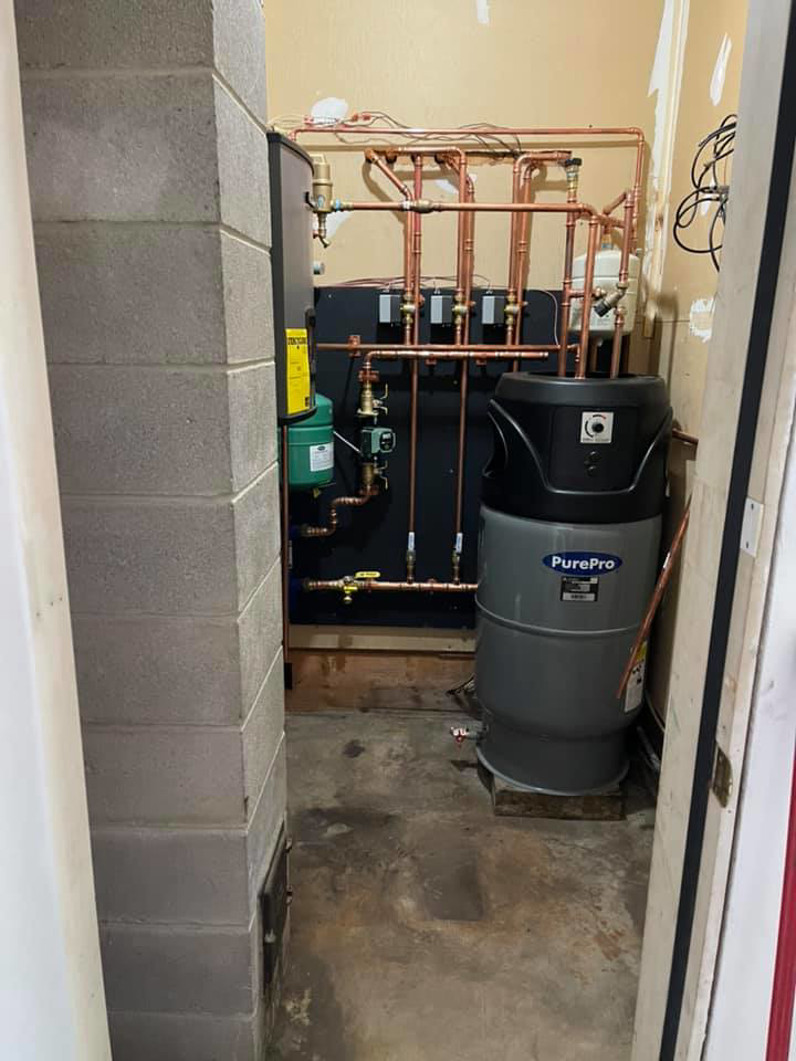 A new heating system installation with a large water storage tank by Aaron Hamilton Heating in Brunswick, ME.