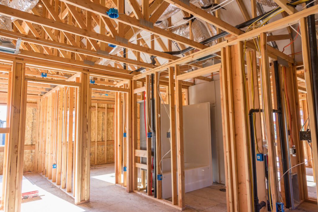 Interior view of a new home under construction showing electrical wiring rough-in by Gold Electric INC in Bend, OR.