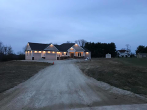 New home with professional exterior lighting installation by Alien Electric Inc. in Dayton, OH.