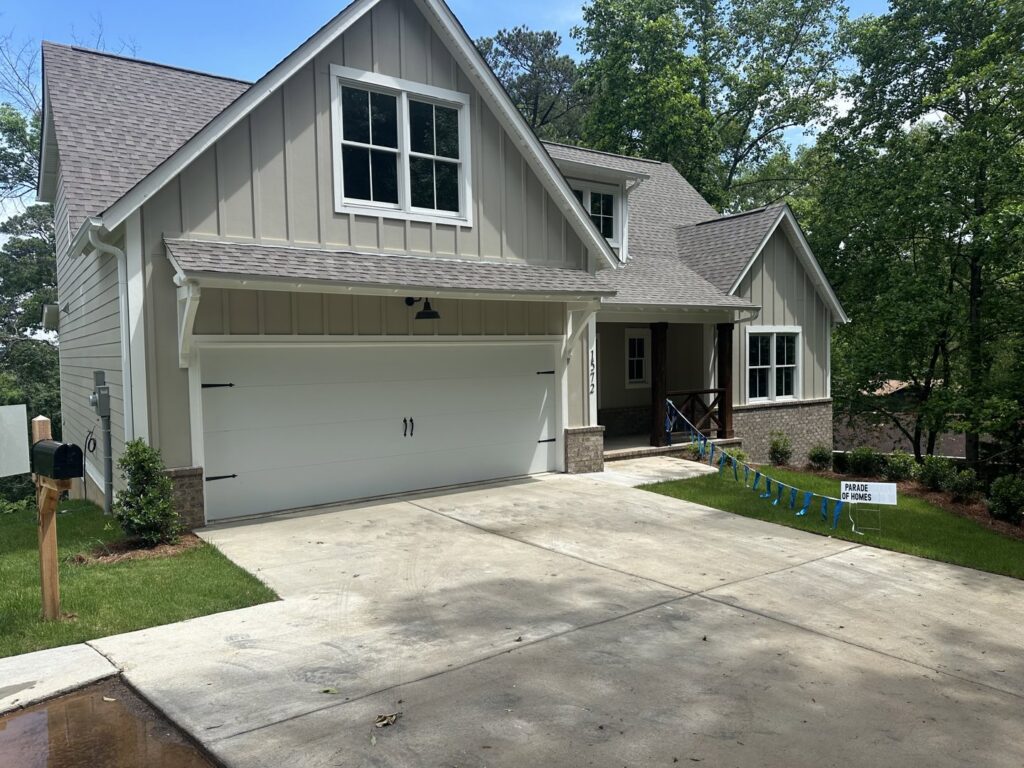A newly built home featuring a white garage door installed by Platinum Garage Door Services in Helena, AL