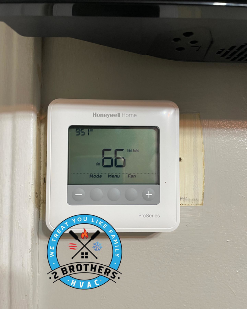 A new Honeywell Home thermostat displaying 66 degrees, installed by 2 Brothers HVAC in Seguin, TX