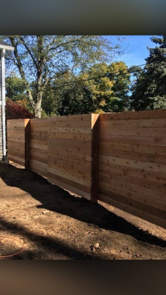 New horizontal wood fence under construction or recently installed in a residential area by Cameron Fence Builders in Indianapolis, IN.