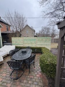 A new horizontal wood fence installed in a backyard patio area by Central Ohio Fence in Newark, OH.