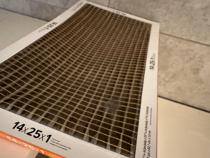 A new, clean HVAC air filter, essential for proper system maintenance by Cardinal State in Mesa, AZ.