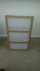 A clean, new HVAC air filter ready for replacement by Air Vent Master in Charlotte, NC.