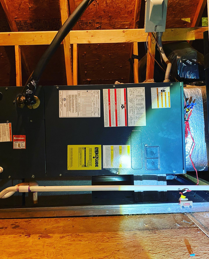 A newly installed HVAC air handler unit in an attic by B & H Heating and Air Services LLC in Local City, ST.