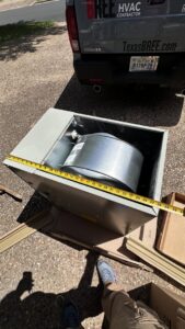 A new HVAC blower motor being prepared for installation by Bree HVAC Contractor in Cedar Park, TX.