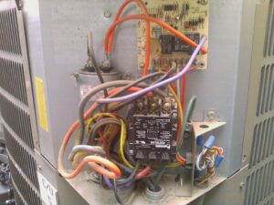 A new HVAC compressor unit, ready for installation or replacement by J AND J HVAC L.L.C in Mesa, AZ