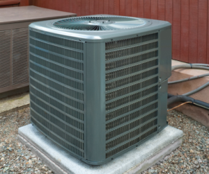 A new outdoor HVAC condenser unit installed on a concrete pad by M Heating & Cooling, Inc. in Green Bay, WI