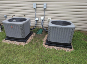 Two new HVAC condenser units installed outside a home by Elite Air and Heat of Summerville, SC.