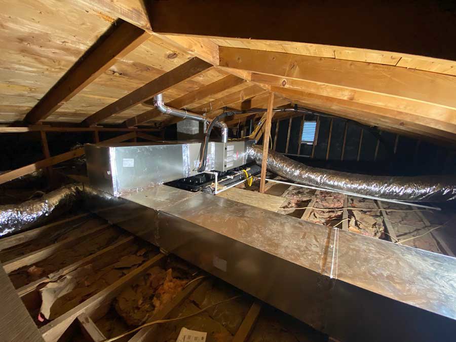 New HVAC ductwork and an air handler unit installed in an attic by Madison HVAC/R, Inc in Richmond, KY.