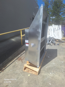 A new large metal HVAC ductwork component on a pallet for Angel's Air Heating & Cooling, LLC in Lakeland, FL.