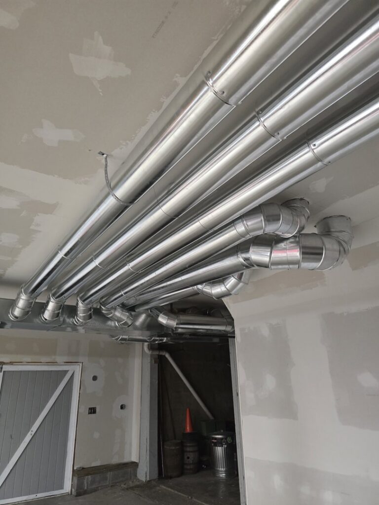 Newly installed HVAC ductwork in a ceiling by Total Comfort Heat and Air Conditioning, Inc. in Rochester, NY.