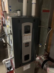 A newly installed or serviced indoor HVAC furnace unit by Americool Heating & Cooling in Richmond, VA.