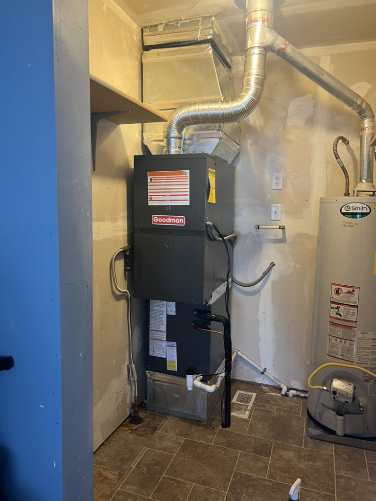 A newly installed Goodman HVAC furnace and ductwork in a utility room by Dan's Heating & Cooling in Las Vegas, NV