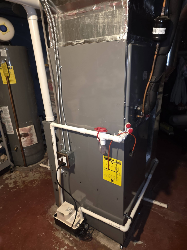 A newly installed HVAC furnace and air handler unit in a basement by DWE Home Services in Cincinnati, OH.